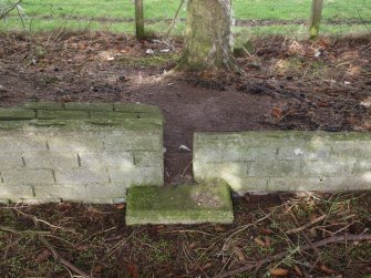A plinth for a timber post on the N side of a barracks