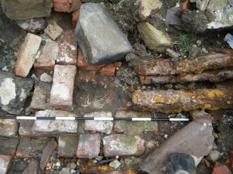 Archaeological evaluation, View of bricks floor in section, Joppa Salt Pan Works