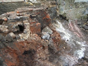 Archaeological excavation, General view of section through flues, Joppa Salt Pan Works