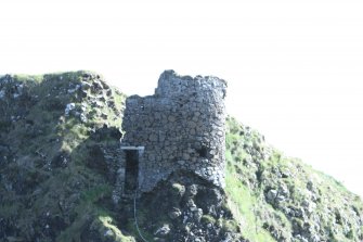 Historic Building Survey photograph, From N, External W-facing elevation, Coroghon Castle, Canna