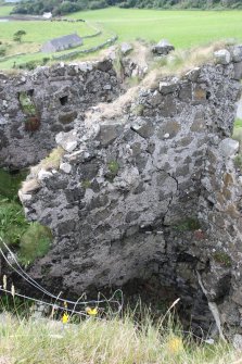 Historic Building Survey photograph, From SE, External E-facing elevation of the W wing, Coroghon Castle, Canna