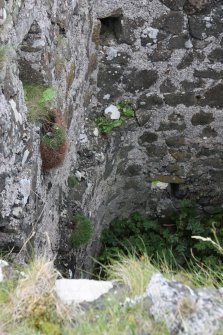 Historic Building Survey photograph, From S, Internal ledge along the W side of the W wing, Coroghon Castle, Canna