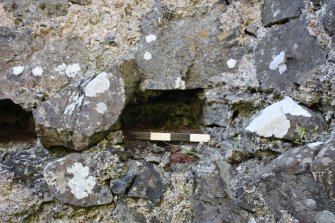 Historic Building Survey photograph, From E, Room C. Detail of floor socket F10 in the W wall, Coroghon Castle, Canna