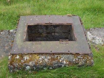 The metal plate around the edge of the escape hatch from the E showing the hinges for the trap door 