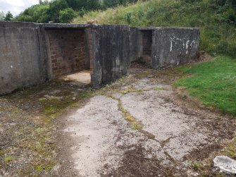 The two ammunition lockers on the S side of the W gun-pit (NS 68139 59862) from the NE