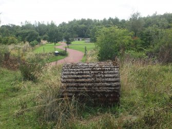 View from the NE of a fluted cast concrete drum (possibly an anti-tank obstacle)