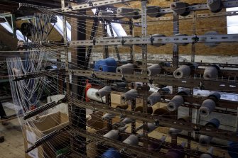 Islay, Bridgend/Redhouses Woollen Mill. Interior, first floor.  Detail of the 'Creel' from which the spun yarn is taken in sections to the warping machine. 