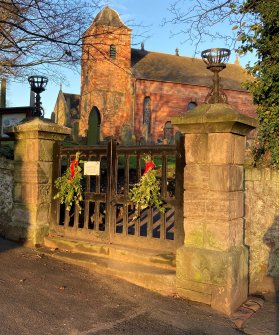 View of main gate to church and churchyard from the SW.