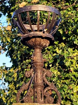 View of iron fire basket set on top of gate-pier.