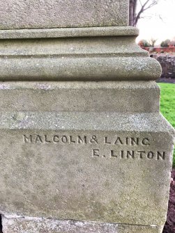 The signature of Malcolm & Laing, a local stone mason in East Linton, on the base of a gravestone.