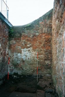 Historic building recording, W wall, Clay bonded walls (20, 21) scarring (22) and upper coursing are visible, Walls to the rear of 126-128 High Street, Dunbar