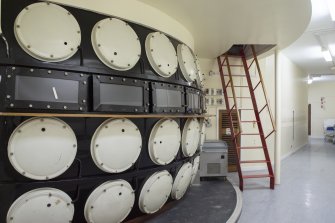 View of corridor showing rear of operating theatre. 