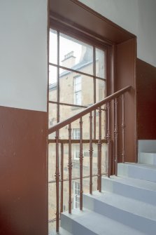 First floor. SW stairwell. View of stair and original railings. 