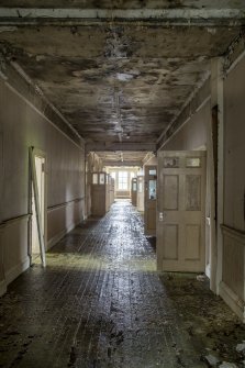 Ground floor. View of northeast corridor. The arcade of the original open gallery can be seen to the left at the end of the corridor