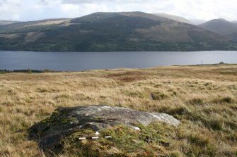 Digital photograph of panel in context with scale, from Scotland's Rock Art Project, Cloanlawers 1, Loch Tay, Perth and Kinross