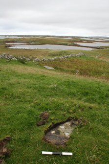 Digital photograph of panel in context with scale, from Scotland’s Rock Art Project, Carinish, Teampull Clann a Phiocair, North Uist, Western Isles
