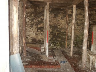 Historic building survey, Building A Room 1 Byre, S interior elevation (left) stall D, Kelton Mill Kennels, Threave Estate, Dumfries and Galloway