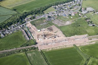 Oblique aerial view of the works for the railway station.