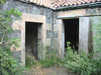 Historic building survey, S exterior wall of cart-house with doorway shown and adjoining W exterior wall of cattle-byre with entrance shown, The Steading, Eastfield Road, Edinburgh