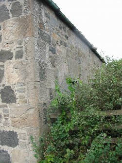 Historic building survey, SE corner of apartments M and N (exterior view) showing entrance modified to form a window, The Steading, Eastfield Road, Edinburgh