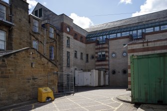 View of Sylvan Place courtyard, from north west with 1990 Campbell and Arnot Building