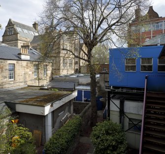 View of temporary buildings  in former gardens behind Rillbank Terrace and Millerfield Place, from north.