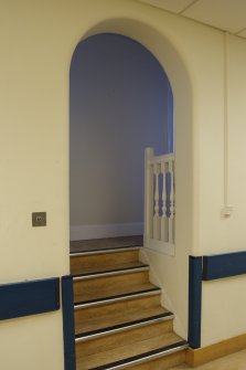 Main block. Second floor central corridor. View of small mezzanine stair. 