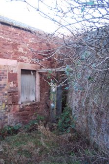 Historic building survey, Corner of exterior wall and site boundary with Petrol pump, Co-op Building, West Barns, Dunbar, East Lothian