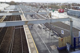 Elevated view of west platform showing site of east station building and remaining structures from north (footbridge)