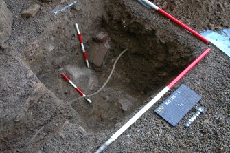 Evaluation photograph, Detail of trench looking NW, Scales indicate brick drain, Lightning conductor trench, Haddo House, Tarves