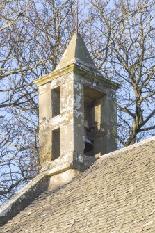 Detail of birdcage bellcote with its stone obelisk spire