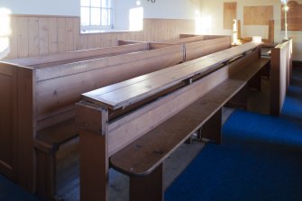 Detail of communion table formed from hinged pew back/ book boards