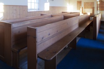 Detail of hinged pew back/book boards in closed position