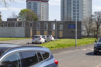 West view of church from Montgomery Road with Gallowhill Court and Glencairn Court tower blocks behind