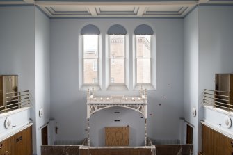 View of courtroom arched windows and canopy from gallery