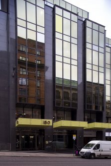 South view of entrance and reflections in windows