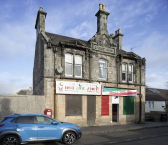 View from south-west showing former Co-op building at Nos 61-63 Main Street, Clackmannan