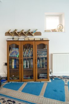 Prayer room. Detail of library bookcase.
