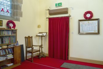 Transept. General view showing Tower entrance door, Elder's chair & original lectern.