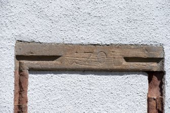Detail of 1701 inscription on lintel to blocked doorway on south front