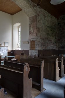 View of north aisle, pews and archway