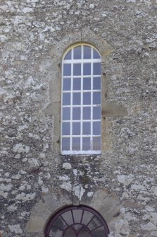 Detail of arched window on east gable