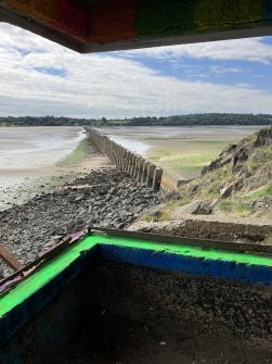 View from searchlight emplacement looking SW over anti-boat barrier