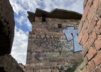 View of gun emplacement from steps of searchlight emplacement 