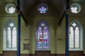 View from east of west arcade and Stained Glass window by Douglas Strachan of Supper at Emmaus 1940's