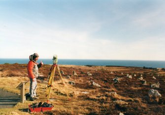 Mr Danny Dutton (Headland Archaeology Ltd) with a robotic EDM during the survey of the Hill of Many Stanes