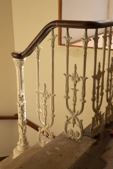 First floor.  Detail of cast iron staircase balustrade.