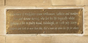 Detail of memorial plaque to Firefighter Ewan Williamson, from south west.