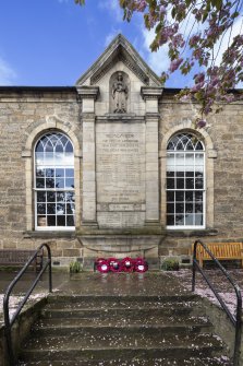 Detail of war memorial and arched windows.