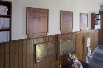 Detail of plaques on east wall of entrance hall